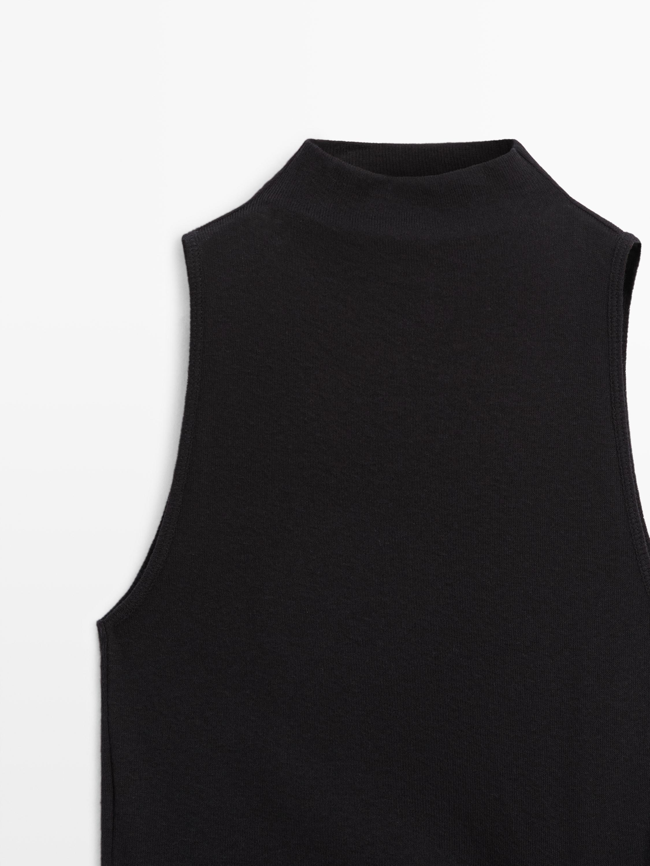 Funnel neck top with brooch detail